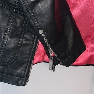 black leather jacket with pink lining